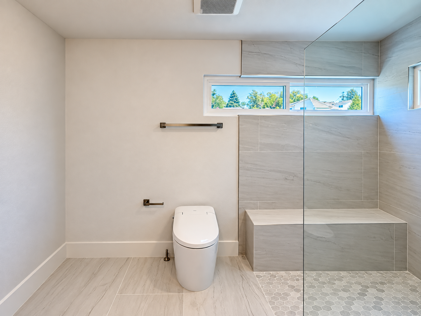Walk-in shower bench in a completed Castro Valley primary bathroom