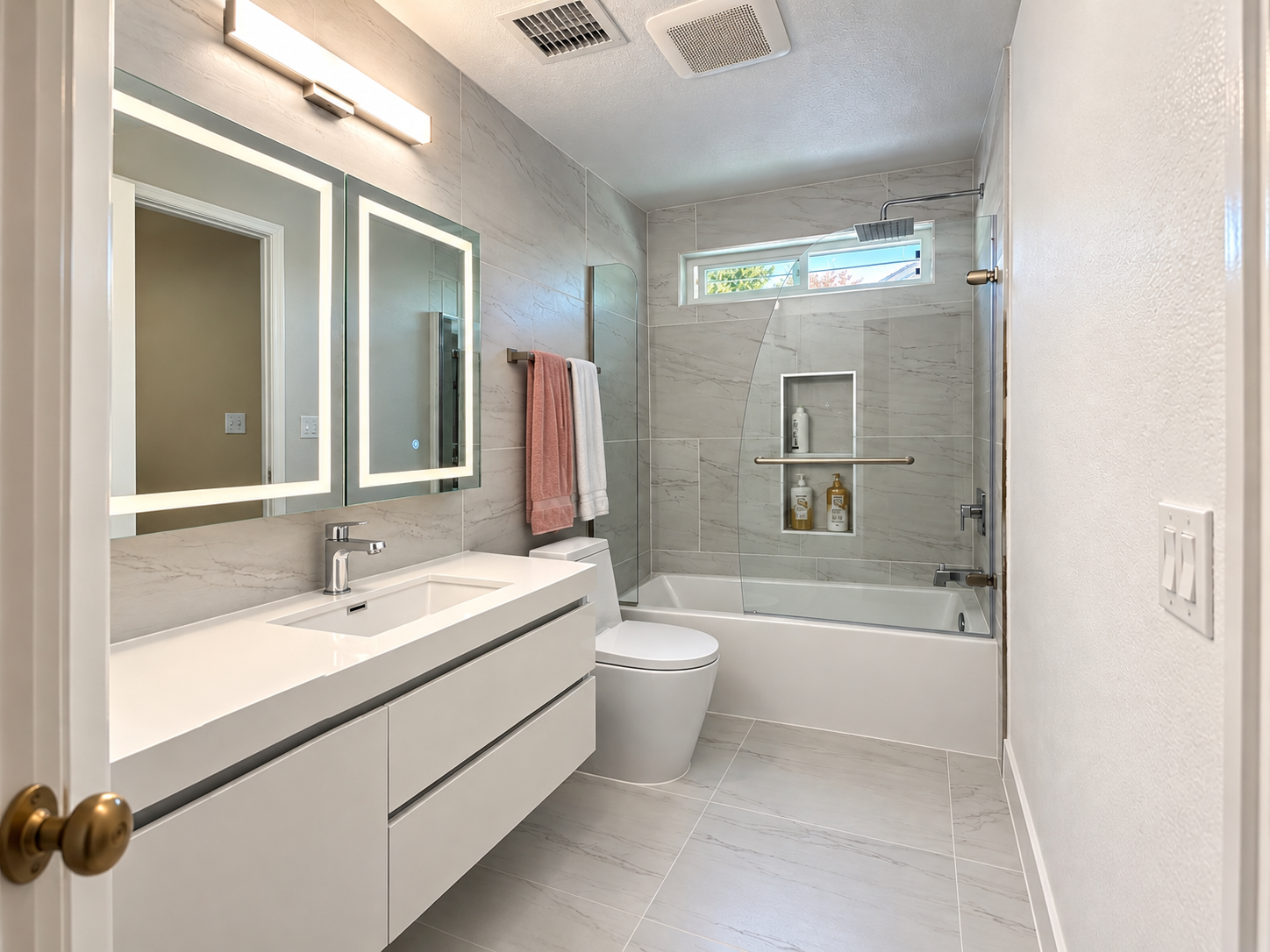 Second full bathroom with tub and shower enclosure and floating vanity