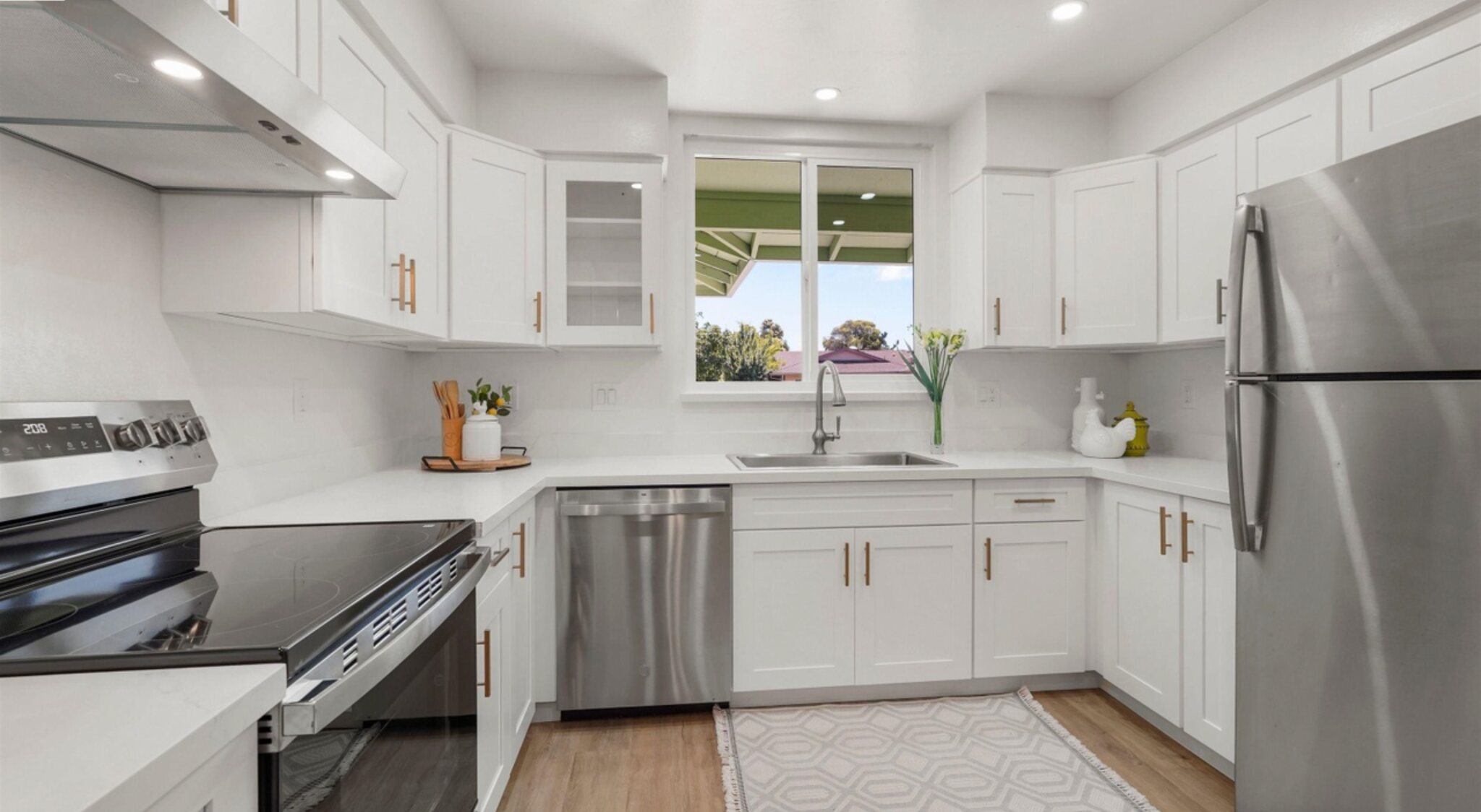 Douglass Street kitchen with white cabinets and stainless appliances
